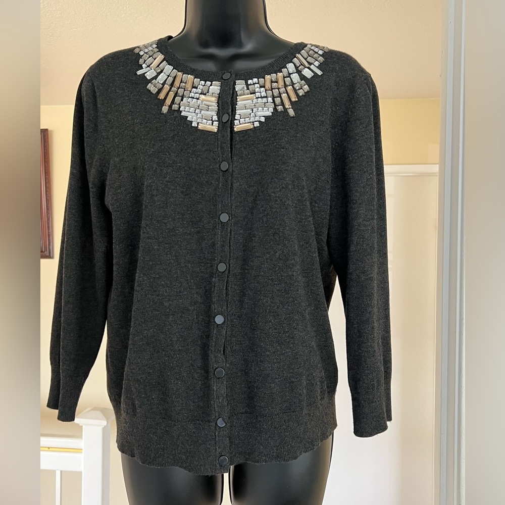Women’s sweater with bling detail around neckline, button down.